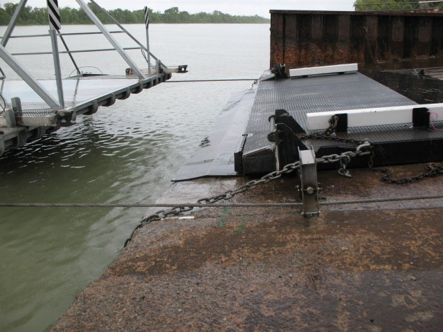 Ferry approaches the landing point chained down on a concrete ramp