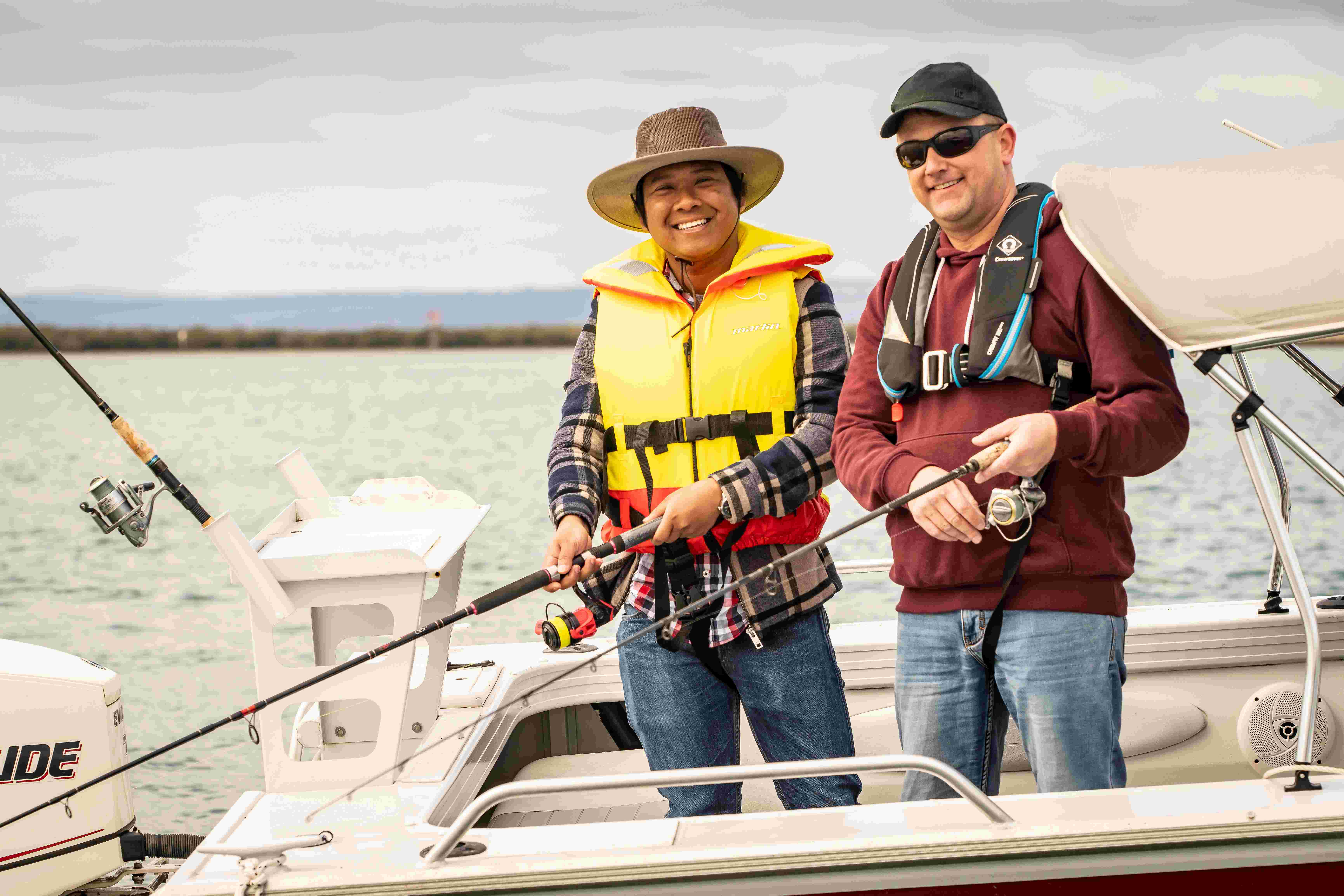 Two men fishing in a vessel