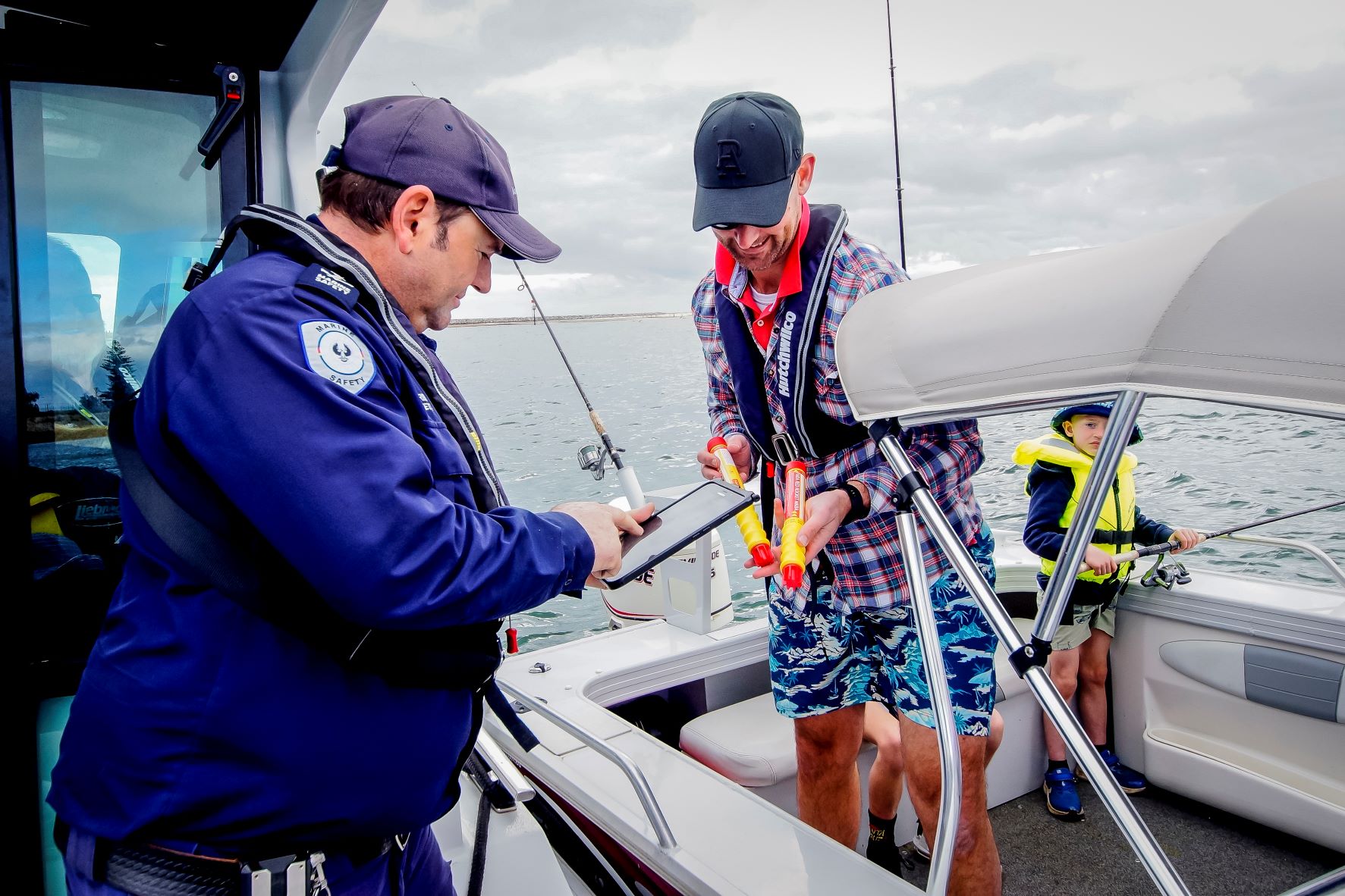 Marine Safety Officer checking flares of boater on water