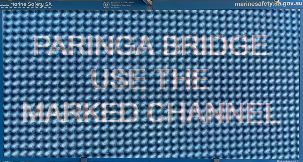 Paringa Bridge use the marked channel displayed on a variable message board sign. White writing on a blue background