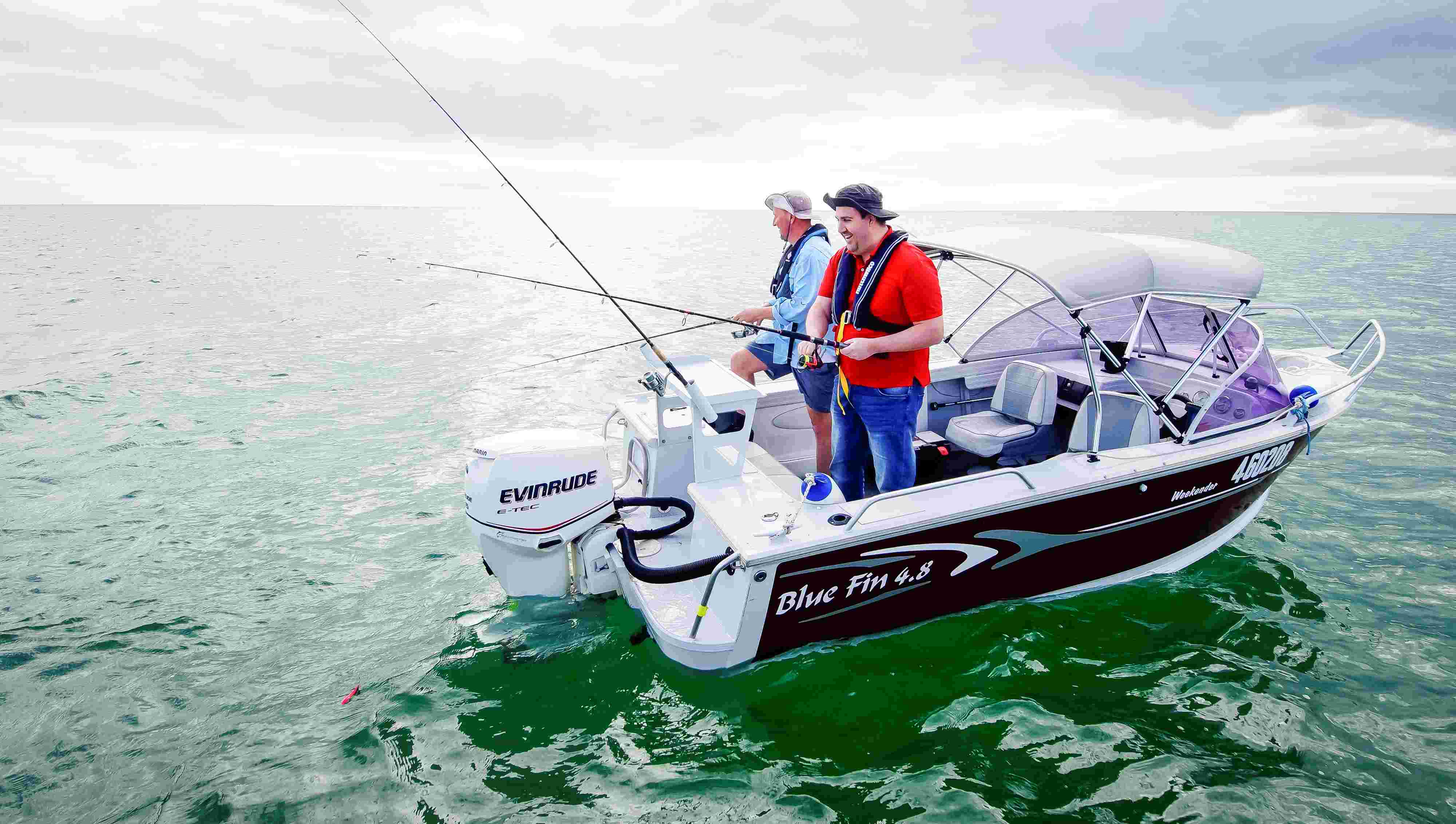 Two men fishing in a vessel